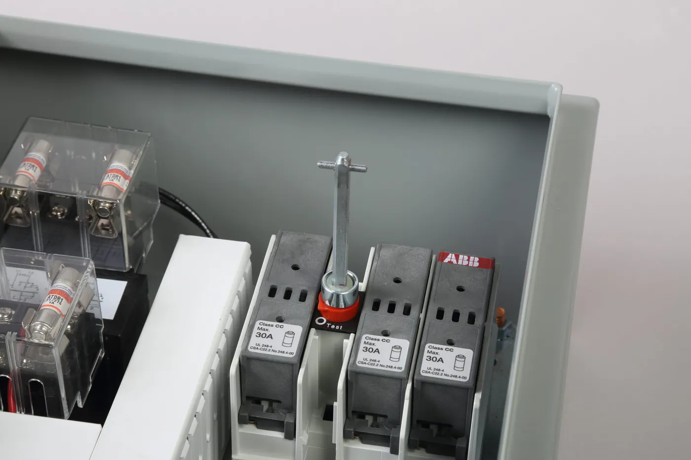 A disconnect shaft fitted to a fused disconnect switch inside a control panel