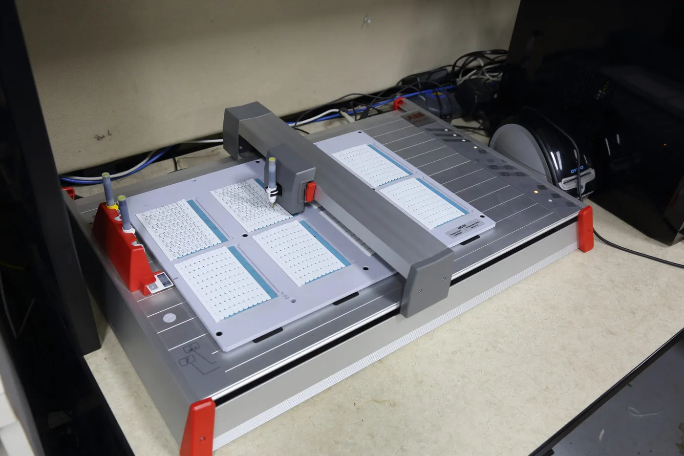 A plotter printing sheets of terminal marker cards